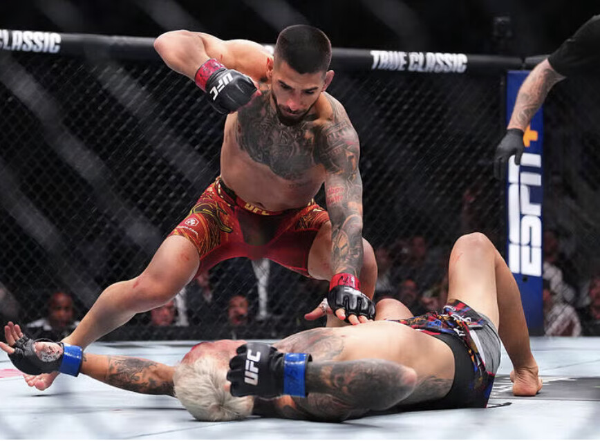 Ground-and-pound in the Octagon — the finishing sequence a title rematch is built to produce